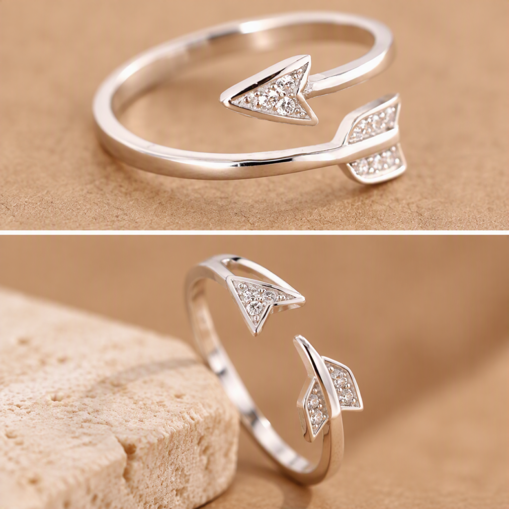 Close-up of the arrowhead and feathered tail on a silver arrow ring