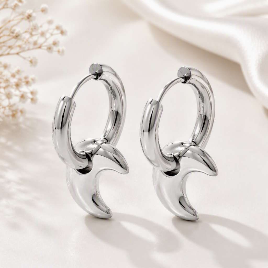 Silver crescent hoop earrings styled with a casual outfit