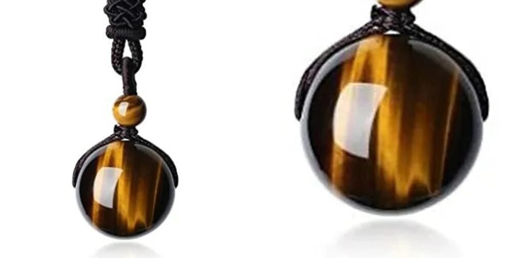Close-up of a tiger eye stone with golden-brown natural banding and shimmer